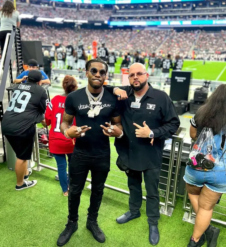CJ So Cool outfit in Versace, Amiri, and Gucci, 2022
