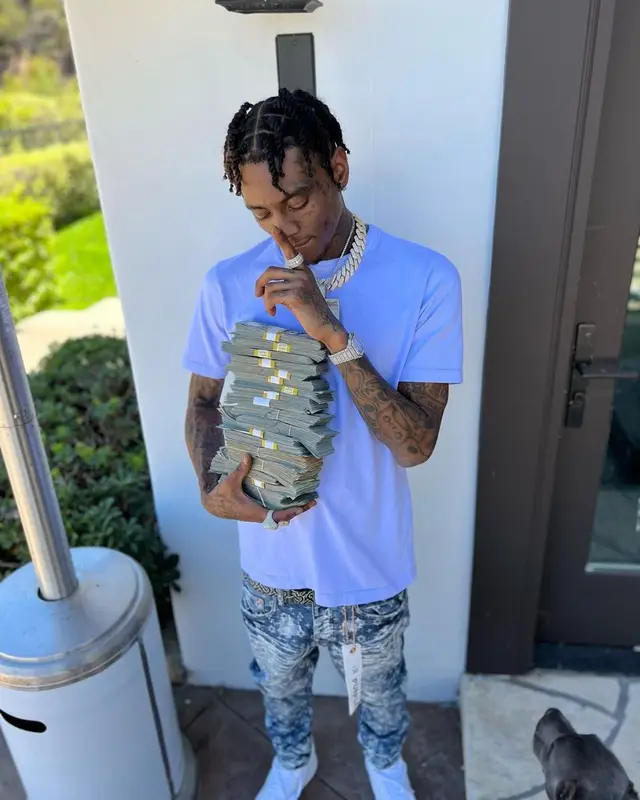 Soulja Boy outfit in Purple Brand, Nike, and Burberry, 2022