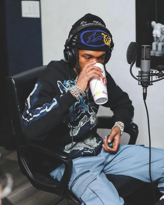 Lil Baby outfit in Fragment, Nike, and Travis Scott Merch, 2022