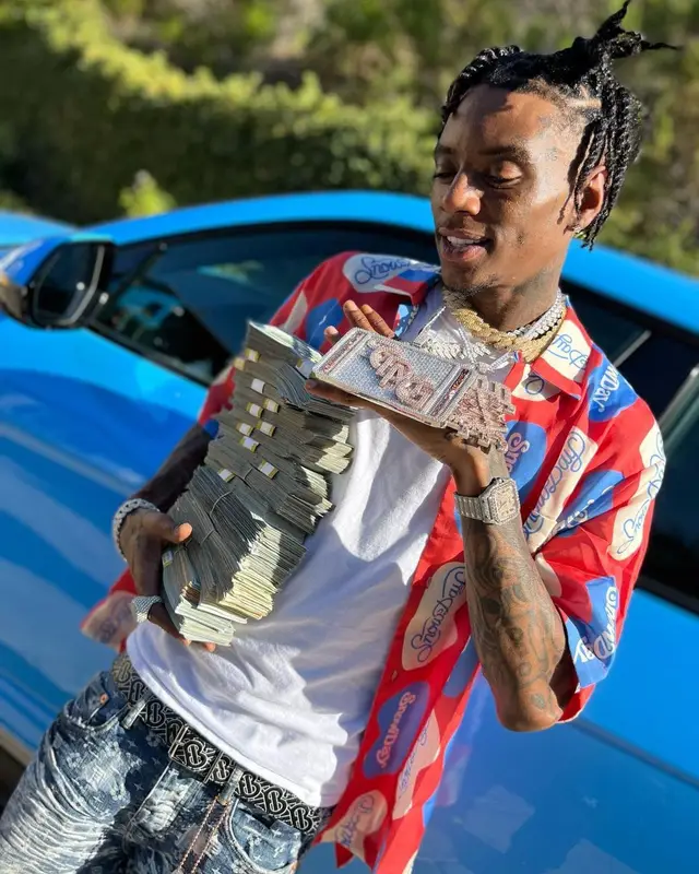 Soulja Boy outfit in Purple Brand, Nike, and Burberry, 2022