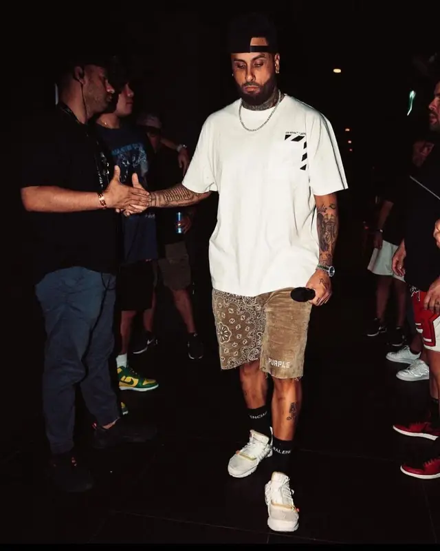 Nicky Jam outfit in Off-White, Purple Brand, and Balenciaga, 2022
