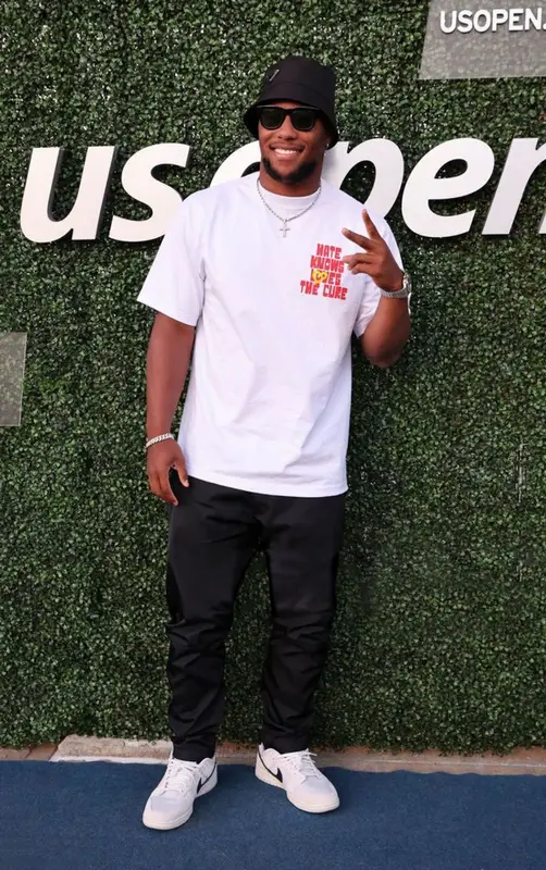 Saquon Barkley outfit in Goodsinners, Nike, and Prada, 2022
