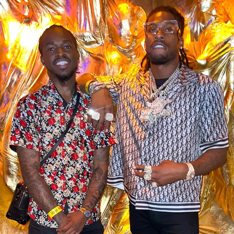CJ So Cool outfit in Dior, Amiri, and Louis Vuitton, 2022