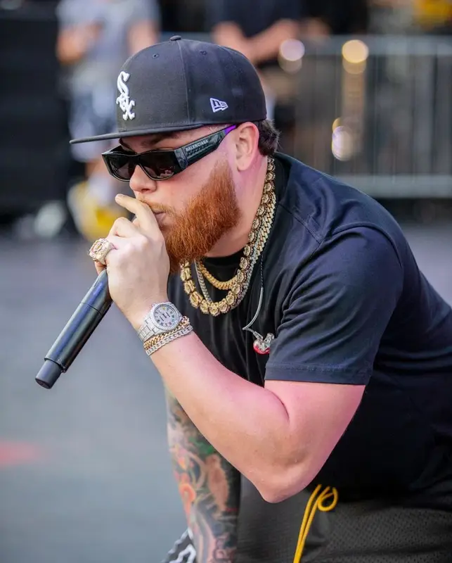 Miky Woodz outfit in Rhude, Balenciaga, and New Era, 2022
