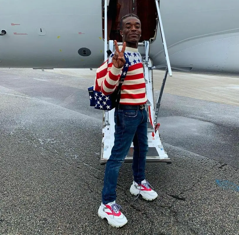 Lil Uzi Vert outfit in Saint Laurent, Prada, and Chanel, 2019