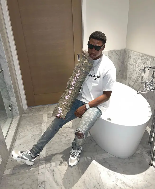 Rob49 outfit in Balenciaga, Amiri, and Dior, 2022
