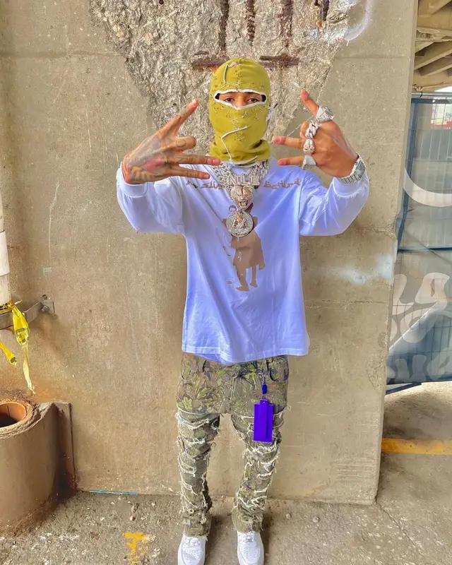 NLE Choppa outfit in Nike, Cartier, and Versace, 2022