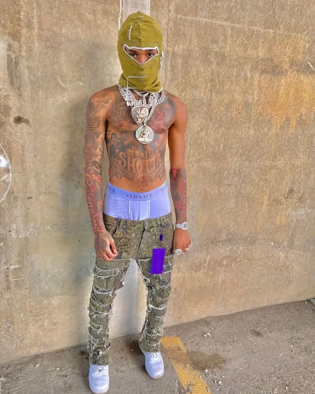 NLE Choppa outfit in Nike, Cartier, and Versace, 2022