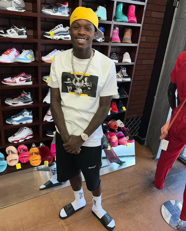 Quando Rondo outfit in Off-White, Fear of God, and New Era, 2022