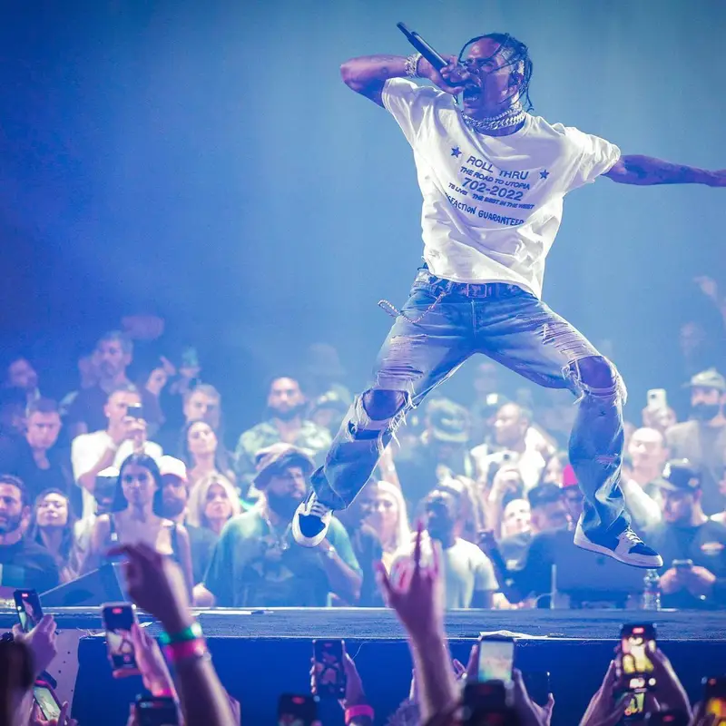 Travis Scott outfit in Travis Scott Merch, Louis Vuitton, and Takashi Murakami, 2022