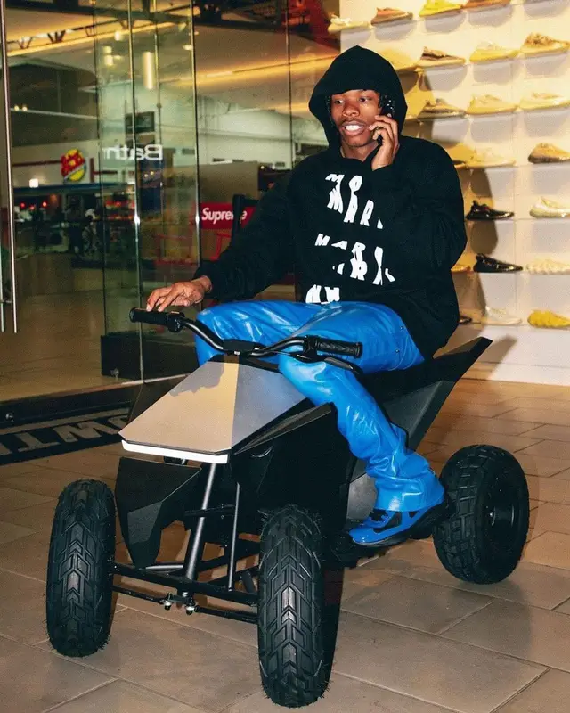 Lil Baby outfit in Marni, Prada, and Tesla Merch, 2022