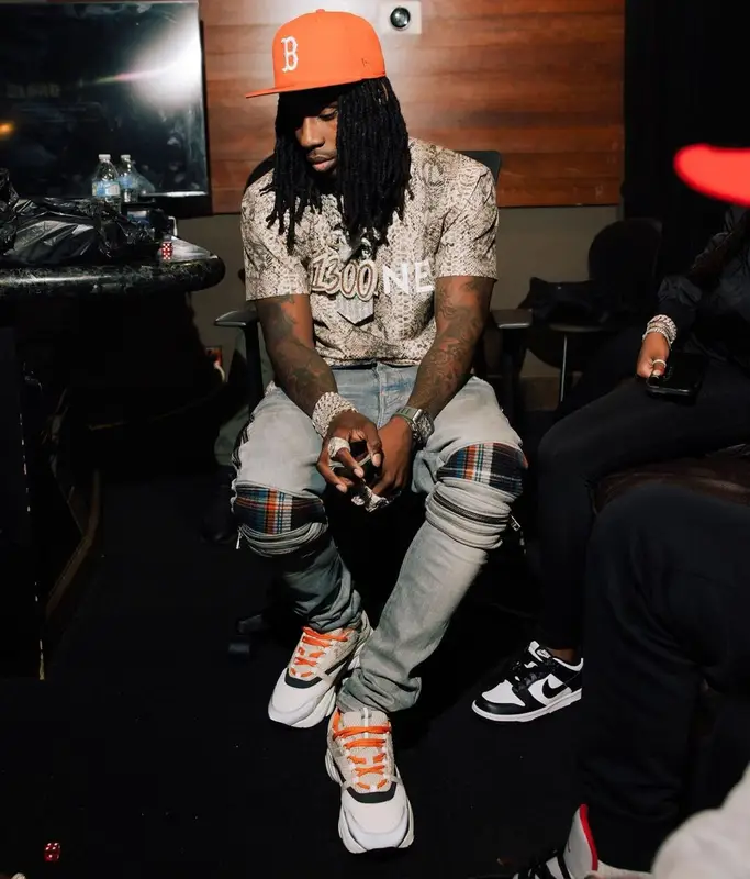 Polo G outfit in Celine, New Era, and Concepts, 2022