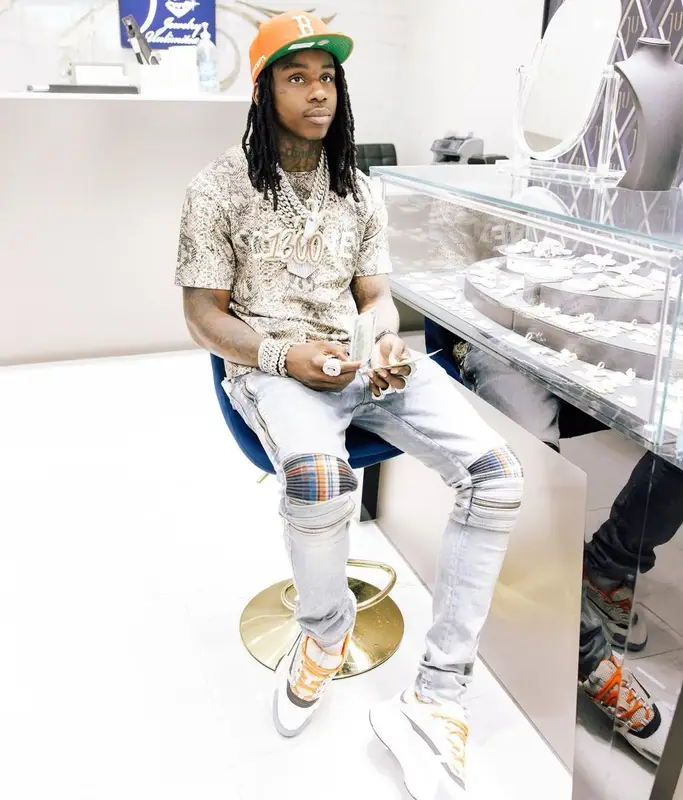 Polo G outfit in Celine, New Era, and Concepts, 2022