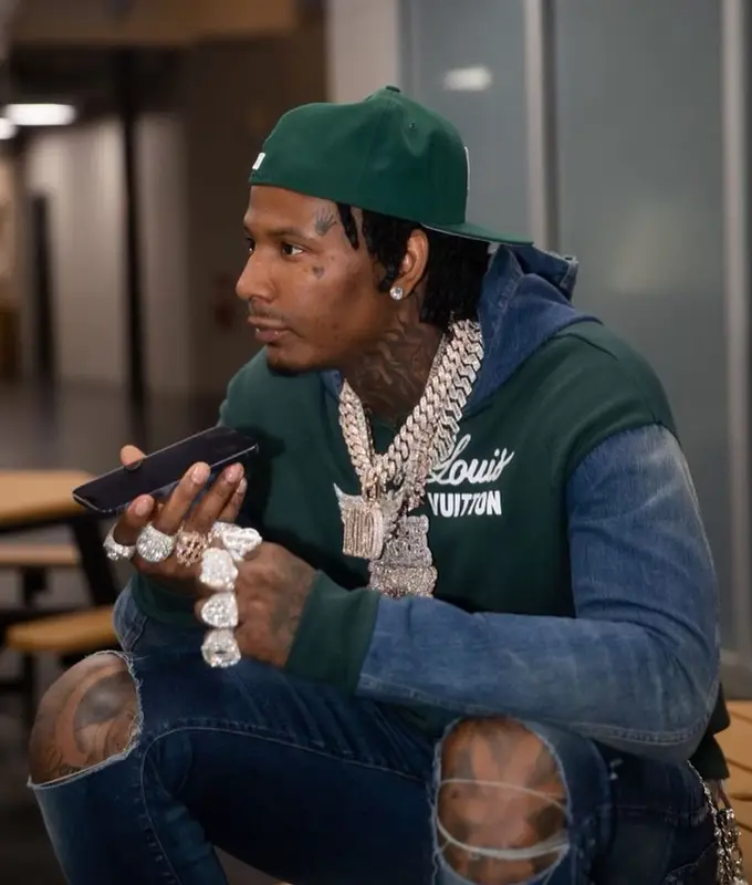 Moneybagg Yo outfit in Louis Vuitton, Amiri, and Nike, 2022