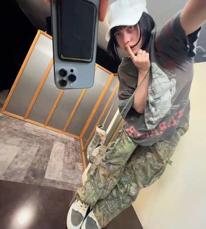 Billie Eilish outfit in Nike, StoreRoomVintage, and Travis Scott Merch, 2022