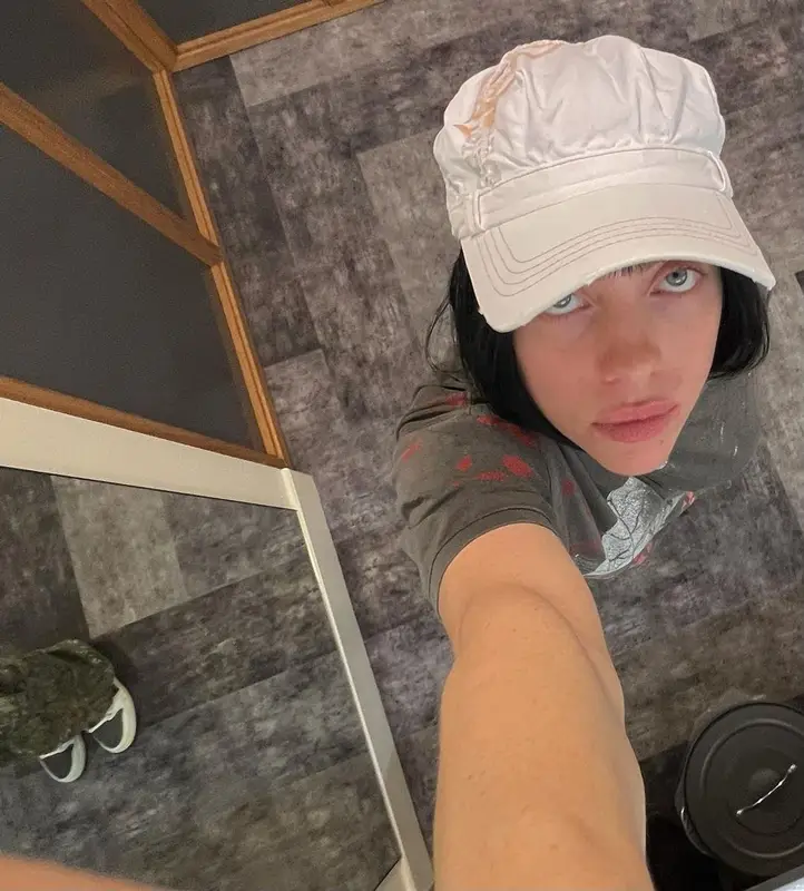 Billie Eilish outfit in Nike, StoreRoomVintage, and Travis Scott Merch, 2022