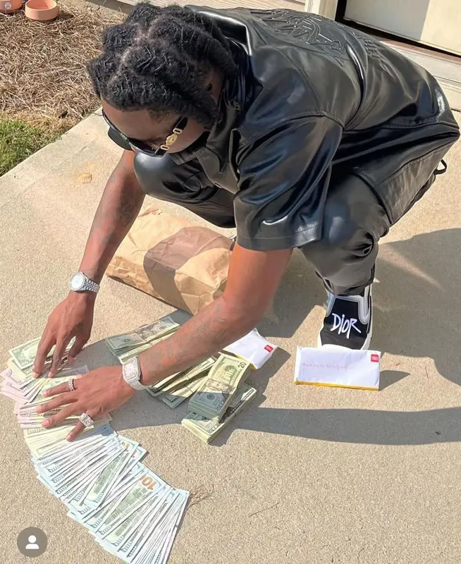 Yung Mal outfit in Zamari, Dior, and Versace, 2022