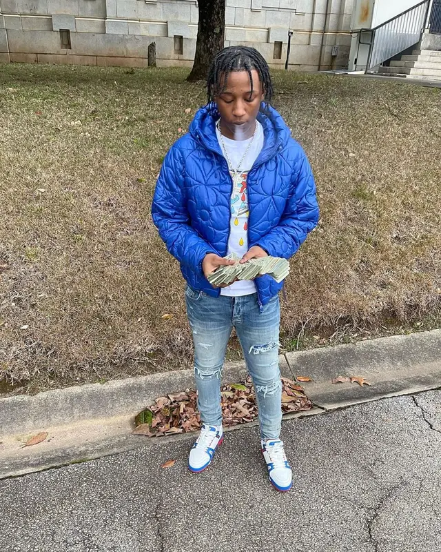 Lil Kee outfit in Louis Vuitton and Amiri, 2022