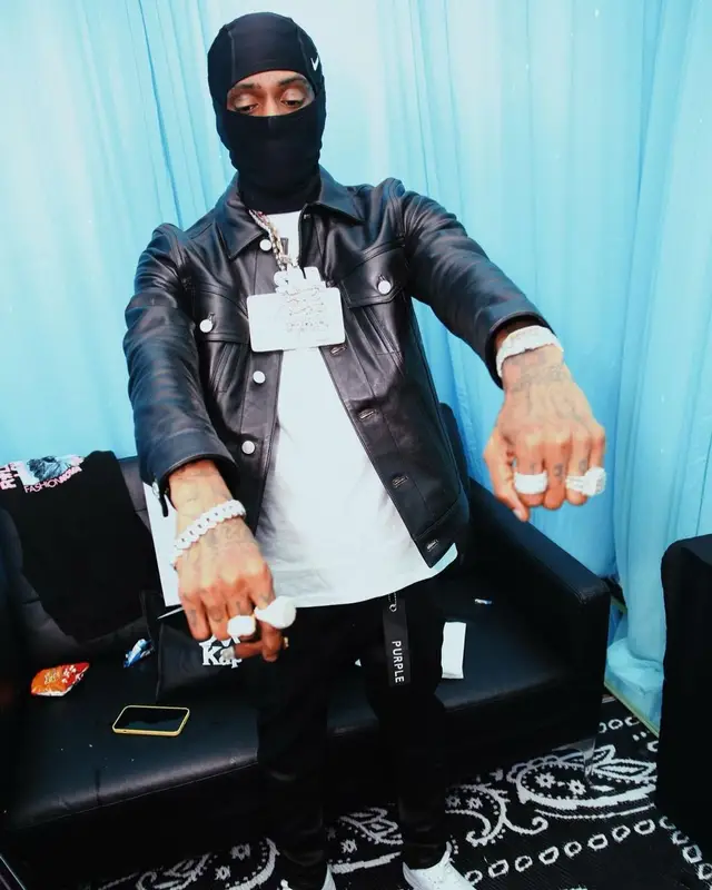 Soulja Boy outfit in Purple Brand, Burberry, and Nike, 2022