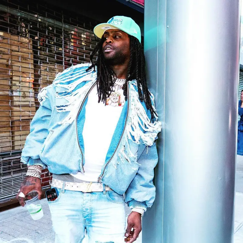 Chief Keef outfit in Diesel, Louis Vuitton, and New Era, 2022