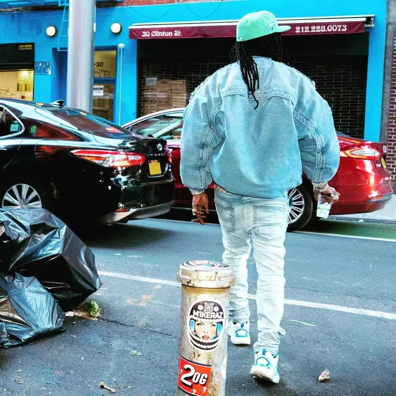 Chief Keef outfit in Diesel, Louis Vuitton, and New Era, 2022