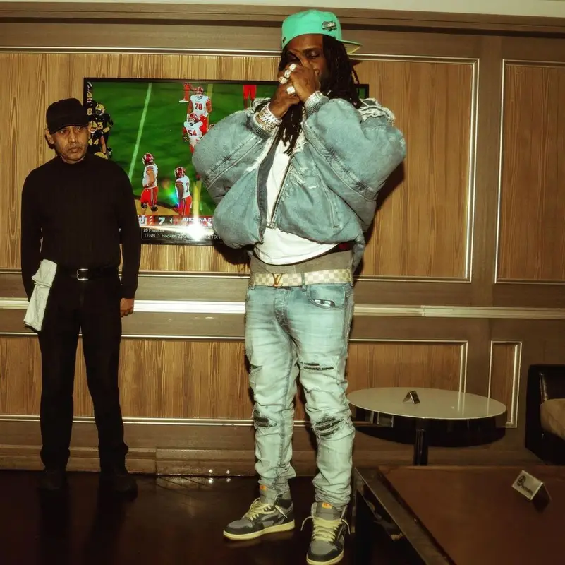 Chief Keef outfit in Diesel, Louis Vuitton, and New Era, 2022