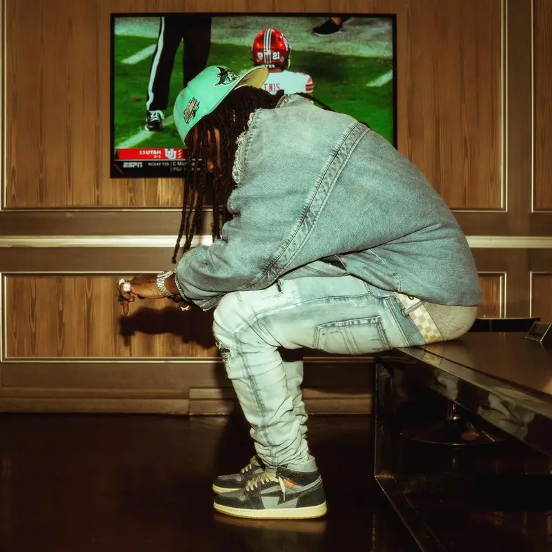 Chief Keef outfit in Diesel, Louis Vuitton, and New Era, 2022