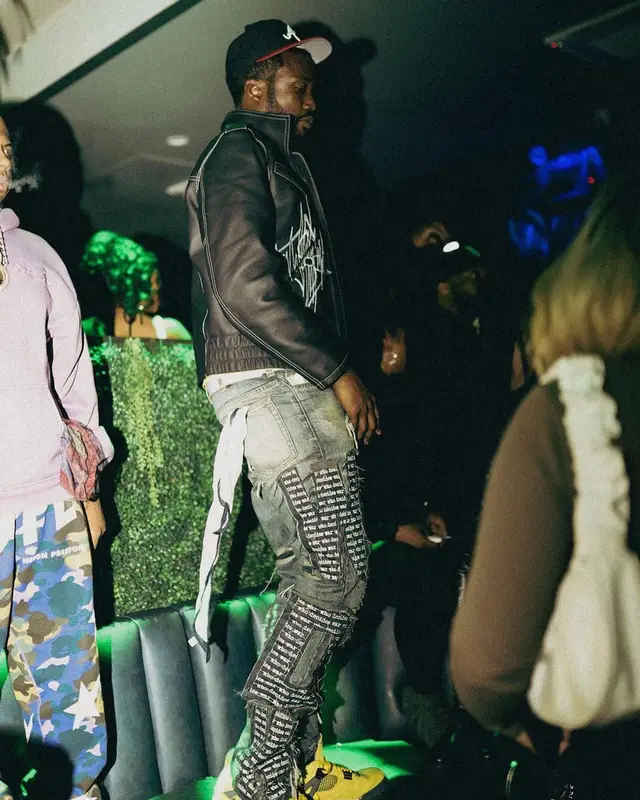 Meek Mill outfit in Louis Vuitton, Who Decides War, and Jordan, 2022