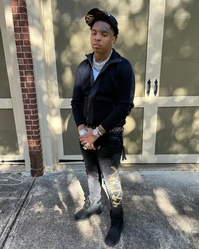 Lil Gotit outfit in Amiri, Dior, and Palm Angels, 2022