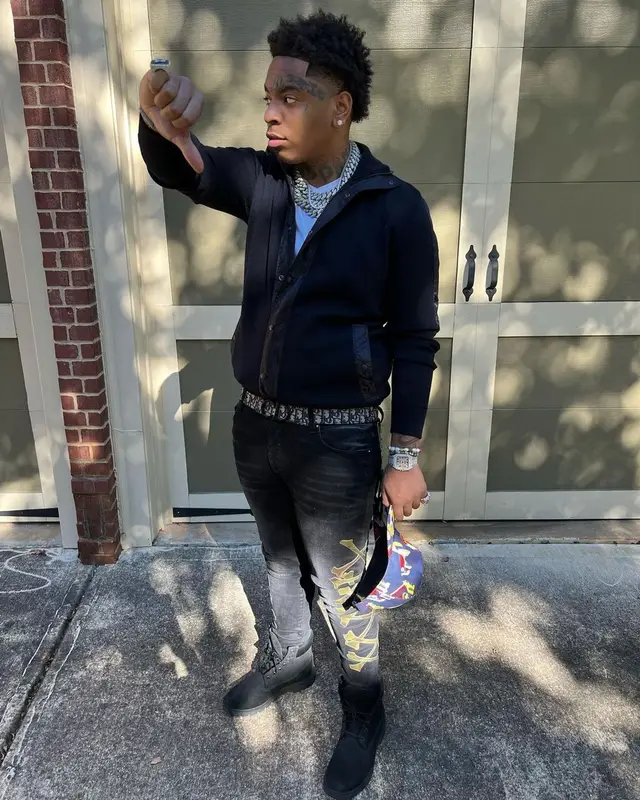 Lil Gotit outfit in Amiri, Dior, and Palm Angels, 2022