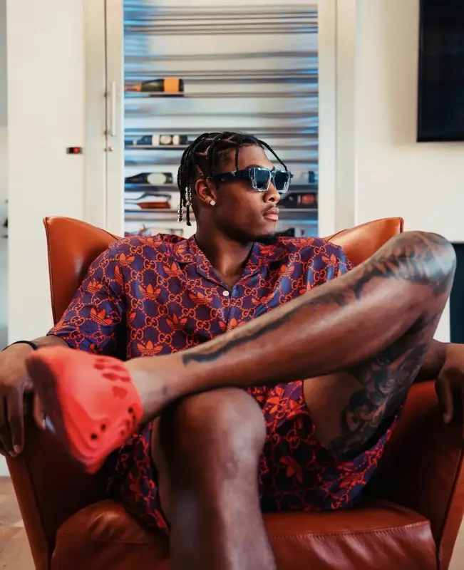 Isaiah Simmons outfit in Gucci, Louis Vuitton, and Adidas, 2022