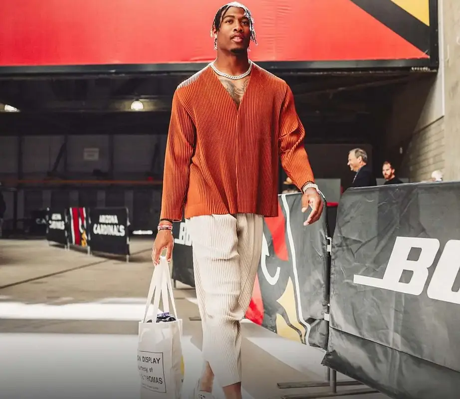 Isaiah Simmons outfit in Issey Miyake and Adidas, 2022