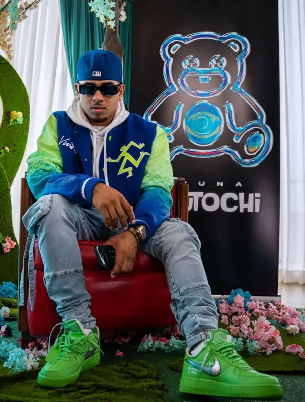 Ozuna outfit in Louis Vuitton, Amiri, and Prada, 2022