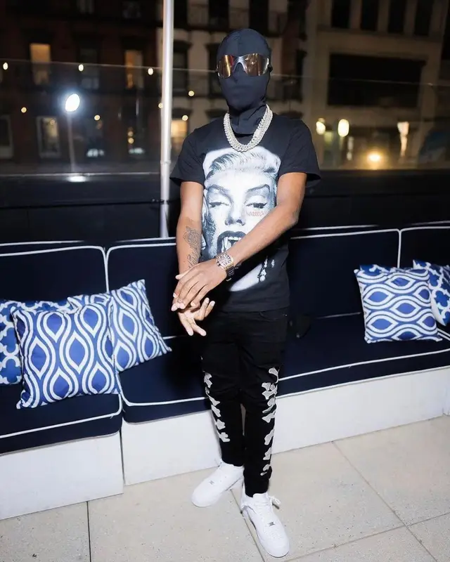 Lil Tjay outfit in Amiri, Yeezy, and GAP, 2022