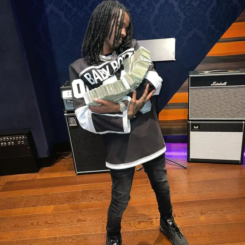 Baby Smoove outfit in Purple Brand, Jordan, and Alexander McQueen, 2022