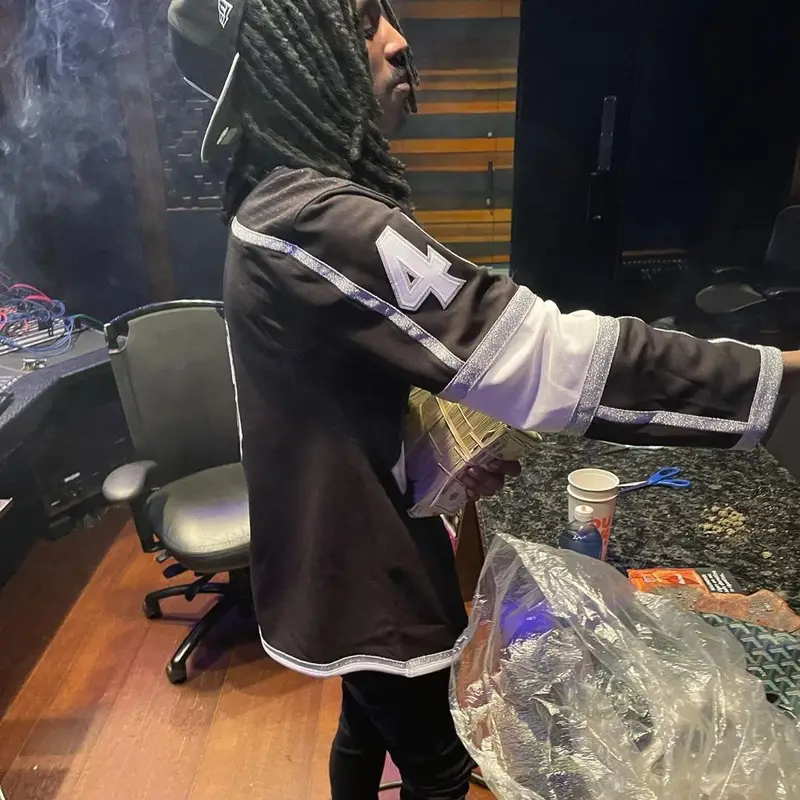 Baby Smoove outfit in Purple Brand, Jordan, and Alexander McQueen, 2022