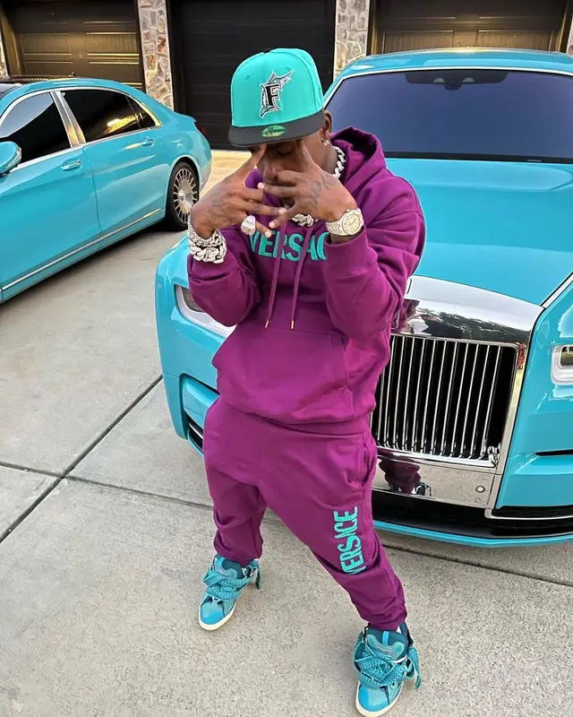 DaBaby outfit in Versace, Lanvin, and New Era, 2022