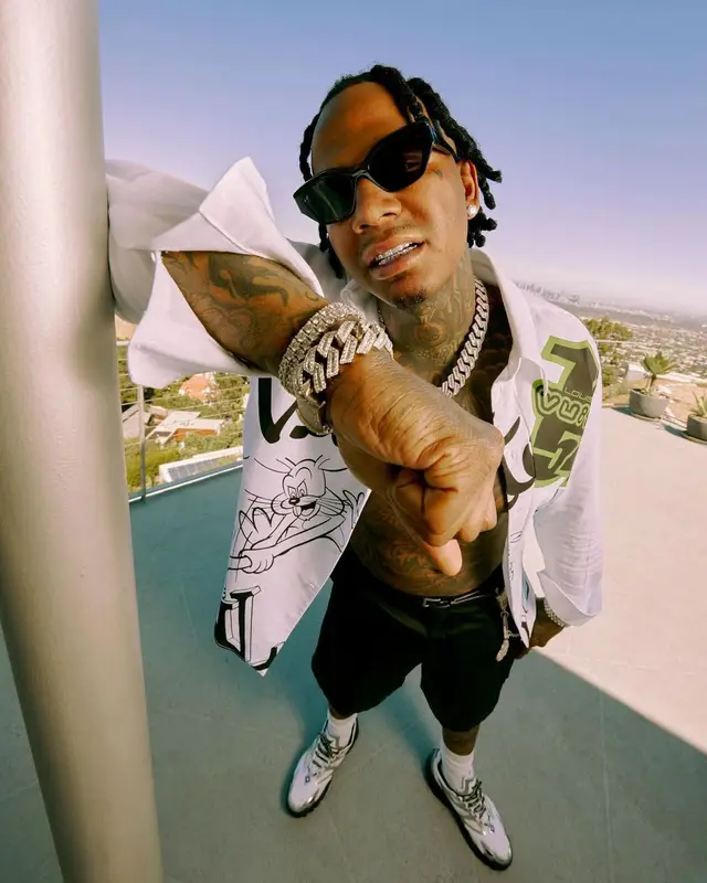 Moneybagg Yo outfit in Louis Vuitton and Prada, 2022