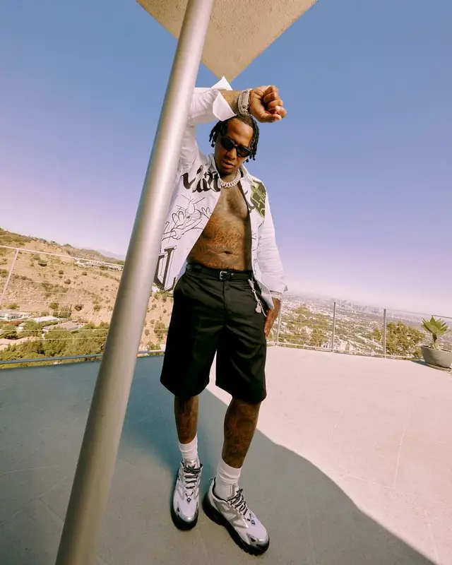 Moneybagg Yo outfit in Louis Vuitton and Prada, 2022
