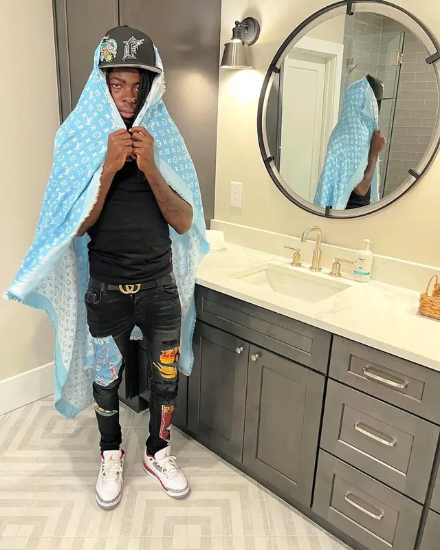 Dee Watkins outfit in Polo Ralph Lauren, New Era, and Louis Vuitton, 2022