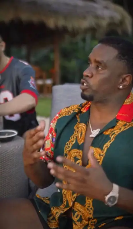 Diddy outfit in J.Logan Home, 2022