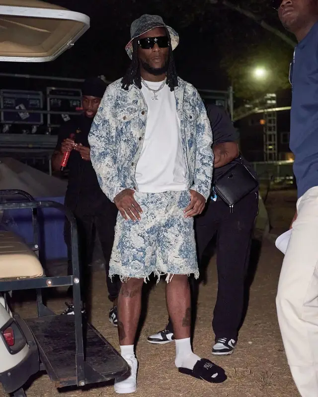 Burna Boy outfit in Nike and Louis Vuitton, 2022