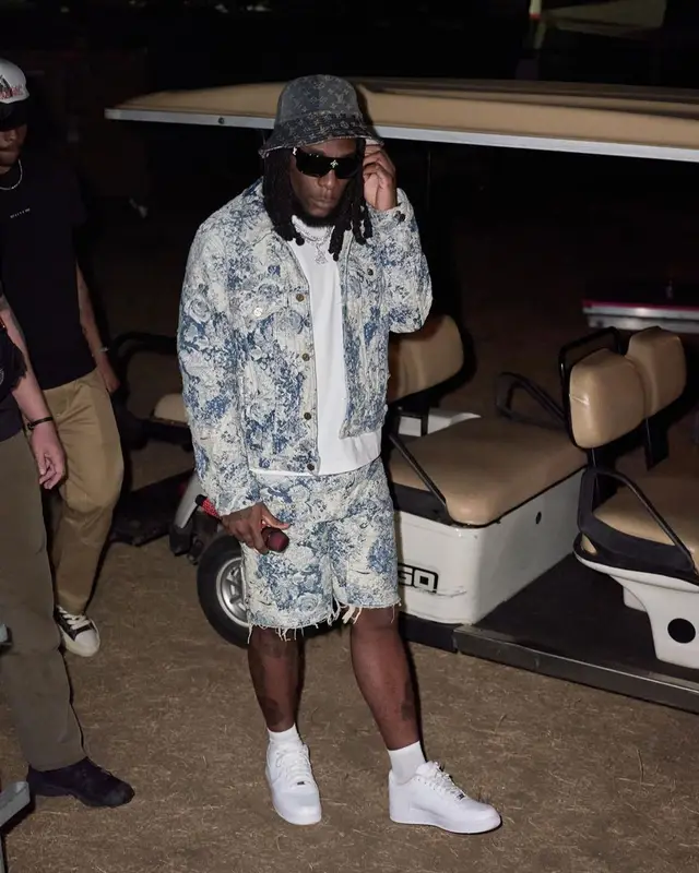 Burna Boy outfit in Nike and Louis Vuitton, 2022