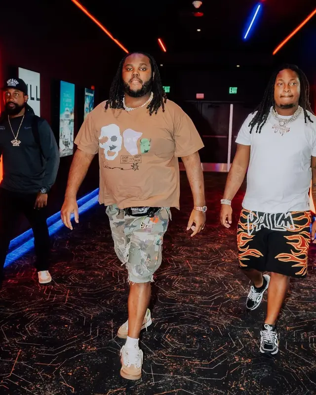 Tee Grizzley outfit in Dior, Saint Laurent, and Travis Scott Merch, 2022