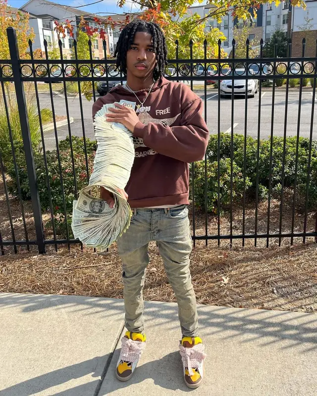 Lil Darius outfit in Barriers, Purple Brand, and Lanvin, 2022