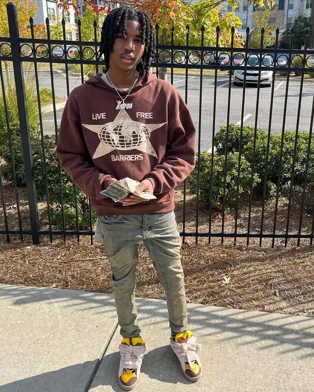 Lil Darius outfit in Barriers, Purple Brand, and Lanvin, 2022