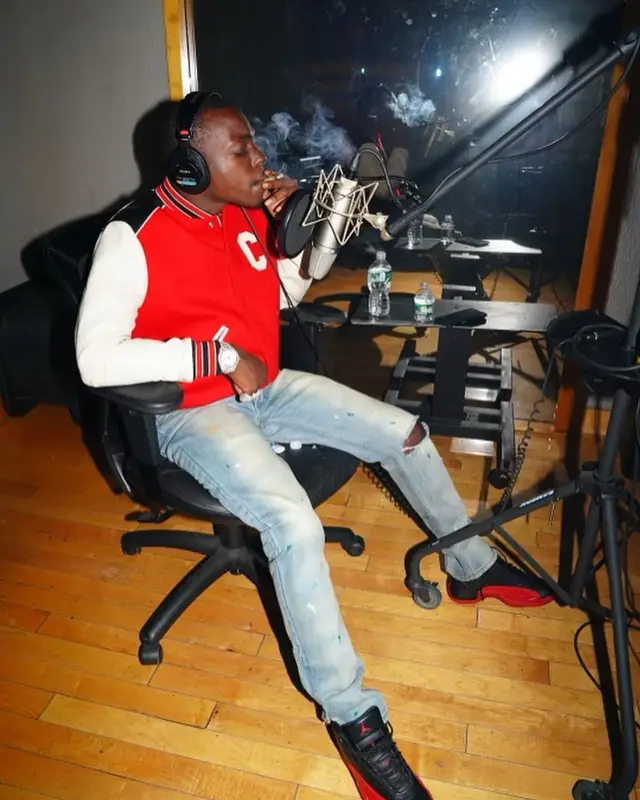Bobby Shmurda outfit in Celine, Amiri, and Prada, 2022