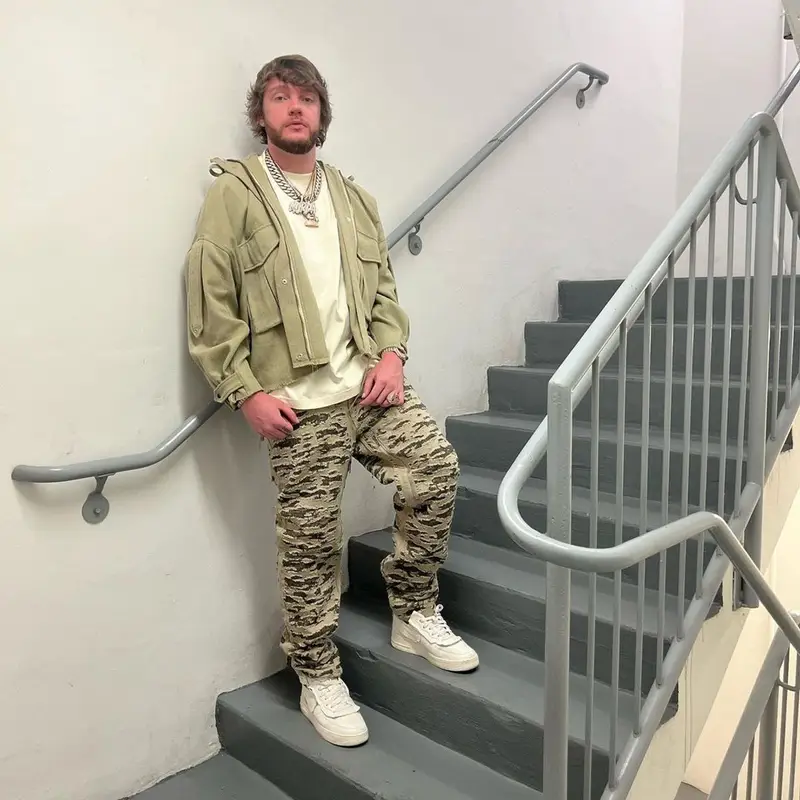 Murda Beatz outfit in Mnml, Givenchy, and Nike, 2022