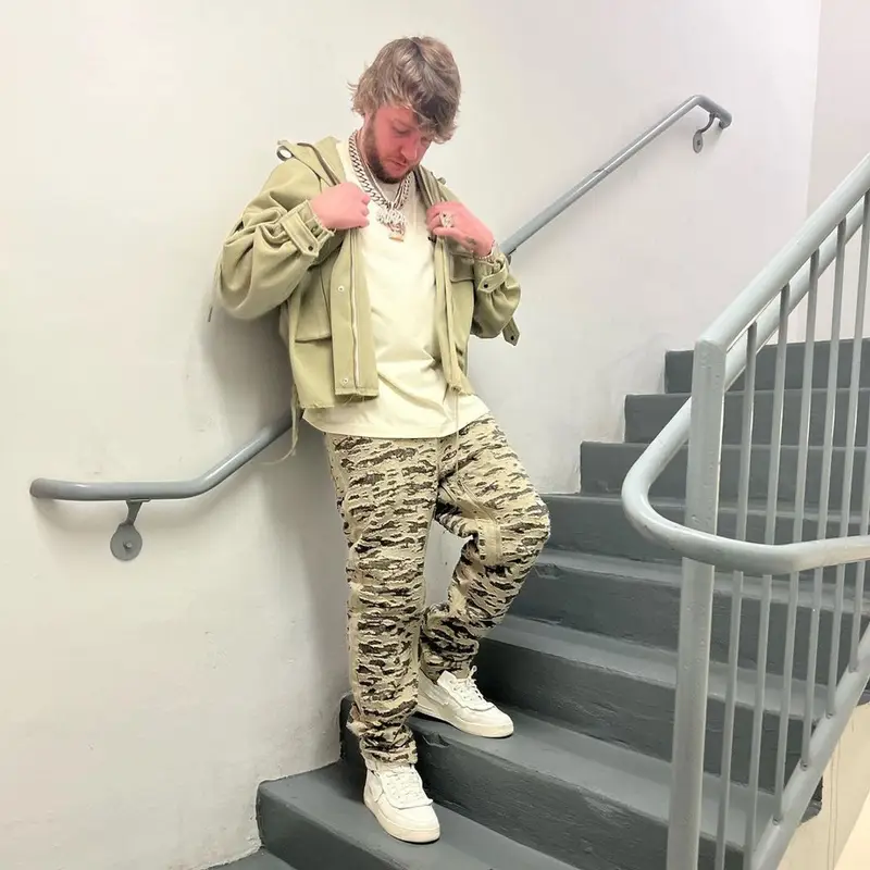 Murda Beatz outfit in Mnml, Givenchy, and Nike, 2022