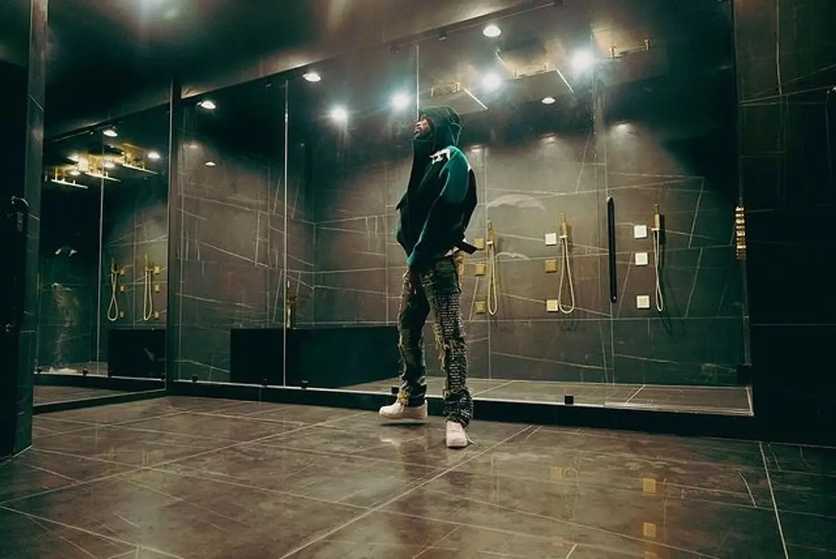 Meek Mill outfit in Louis Vuitton, Who Decides War, and Nike, 2022